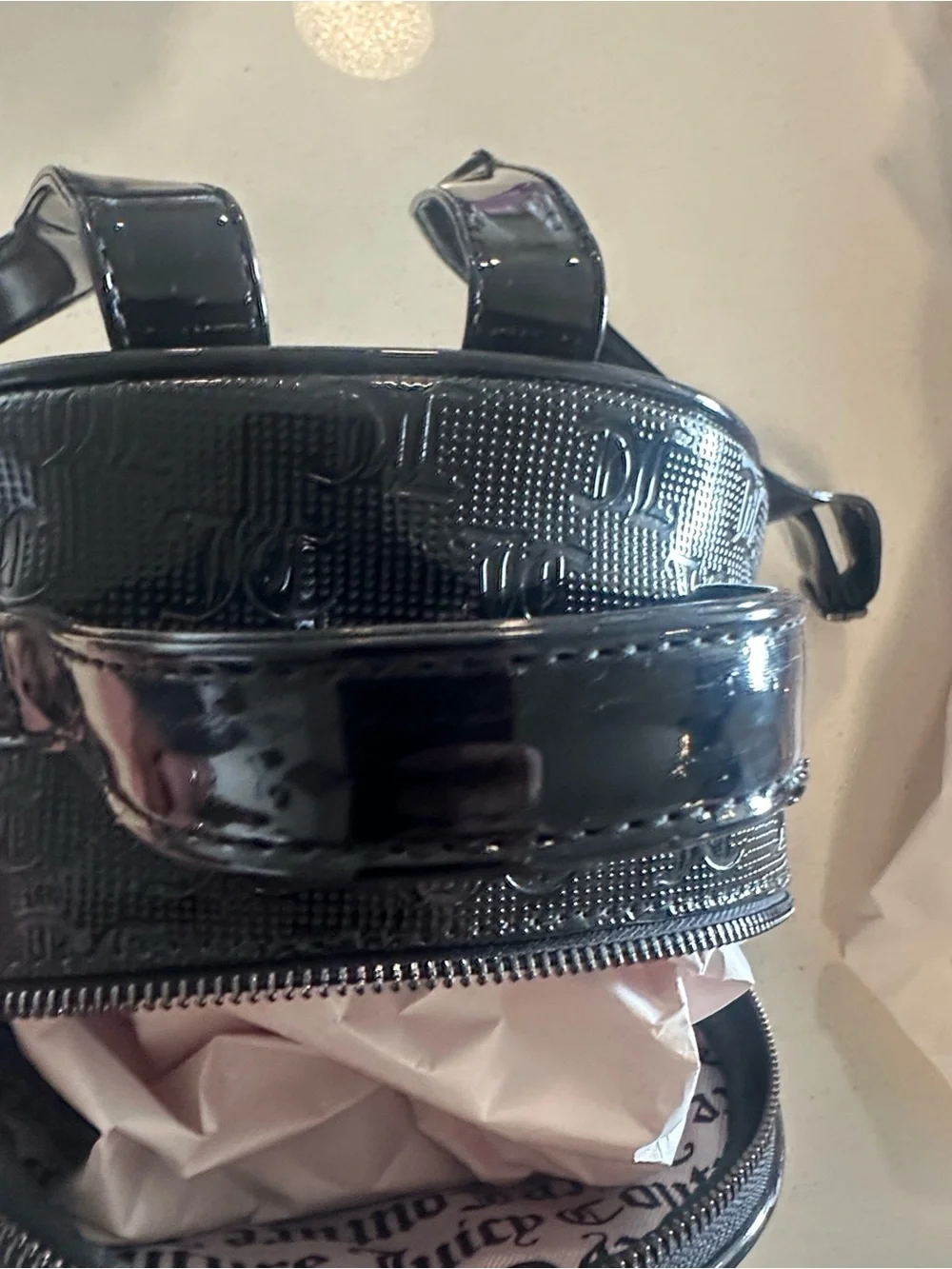 Juicy Couture Black Patent Mini Backpack, new without tags. Excellent condition.